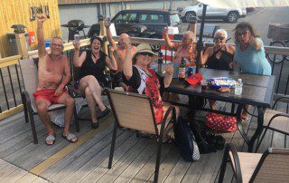 a group of elderly men and women having fun